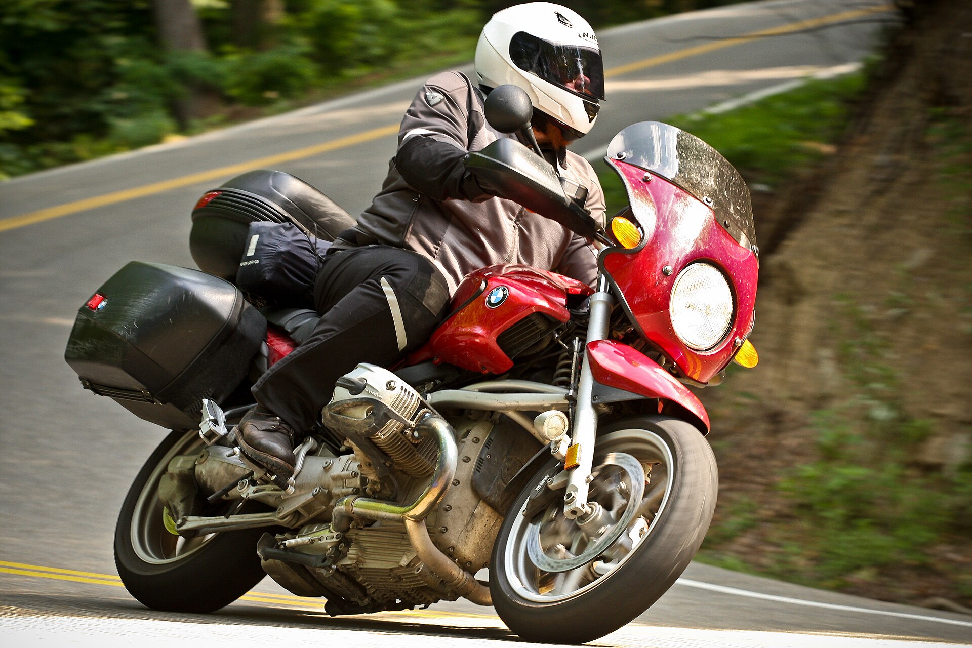 A motorcycle leaning into a curve on the Tail of the Dragon